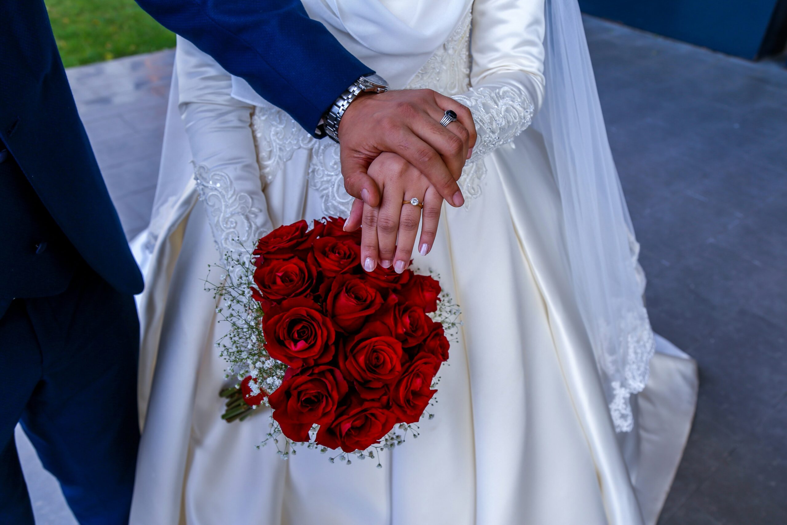 A bride wearing a classic updo styled with pearl hairpins
