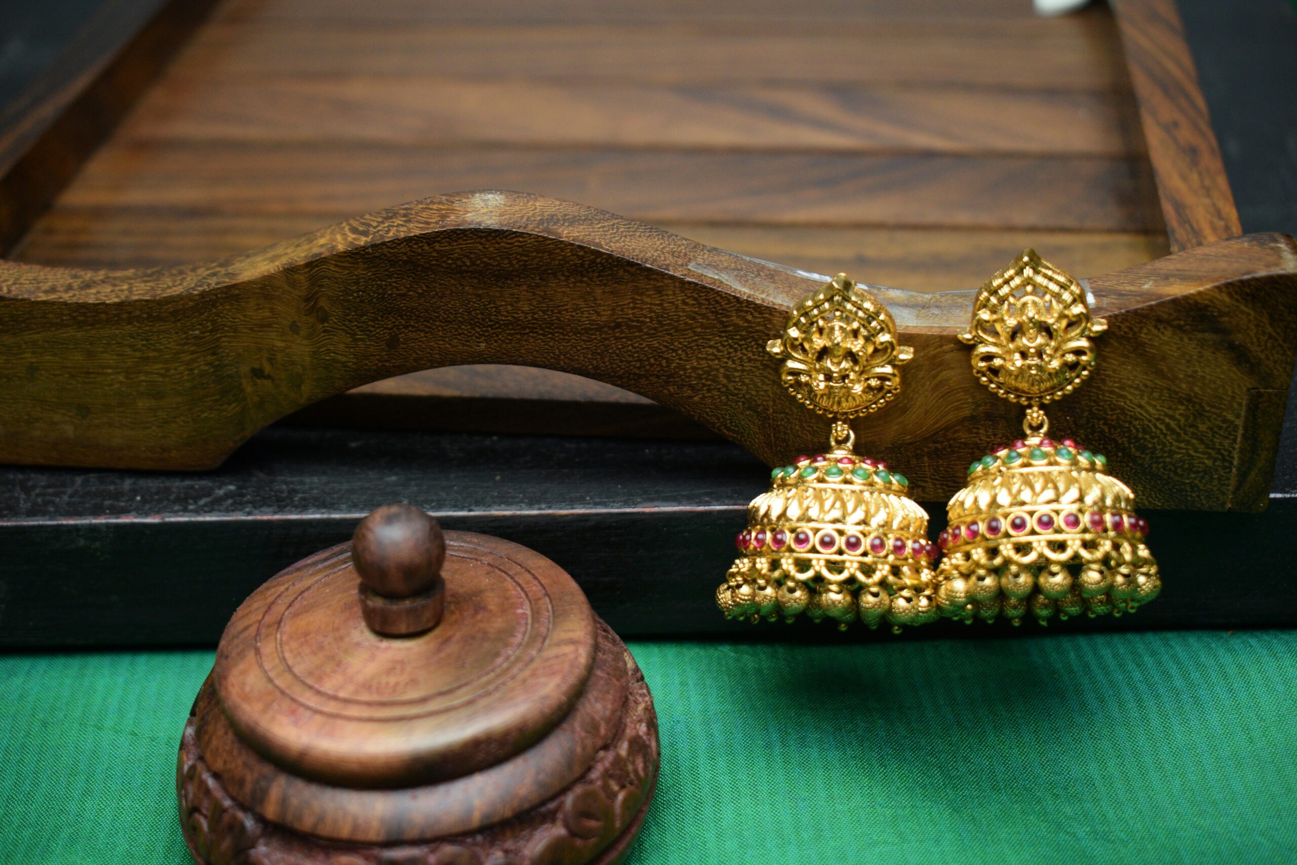 An array of fashionable hair accessories such as decorative combs, sparkly barrettes, and silk scarves laid out neatly on a vanity table