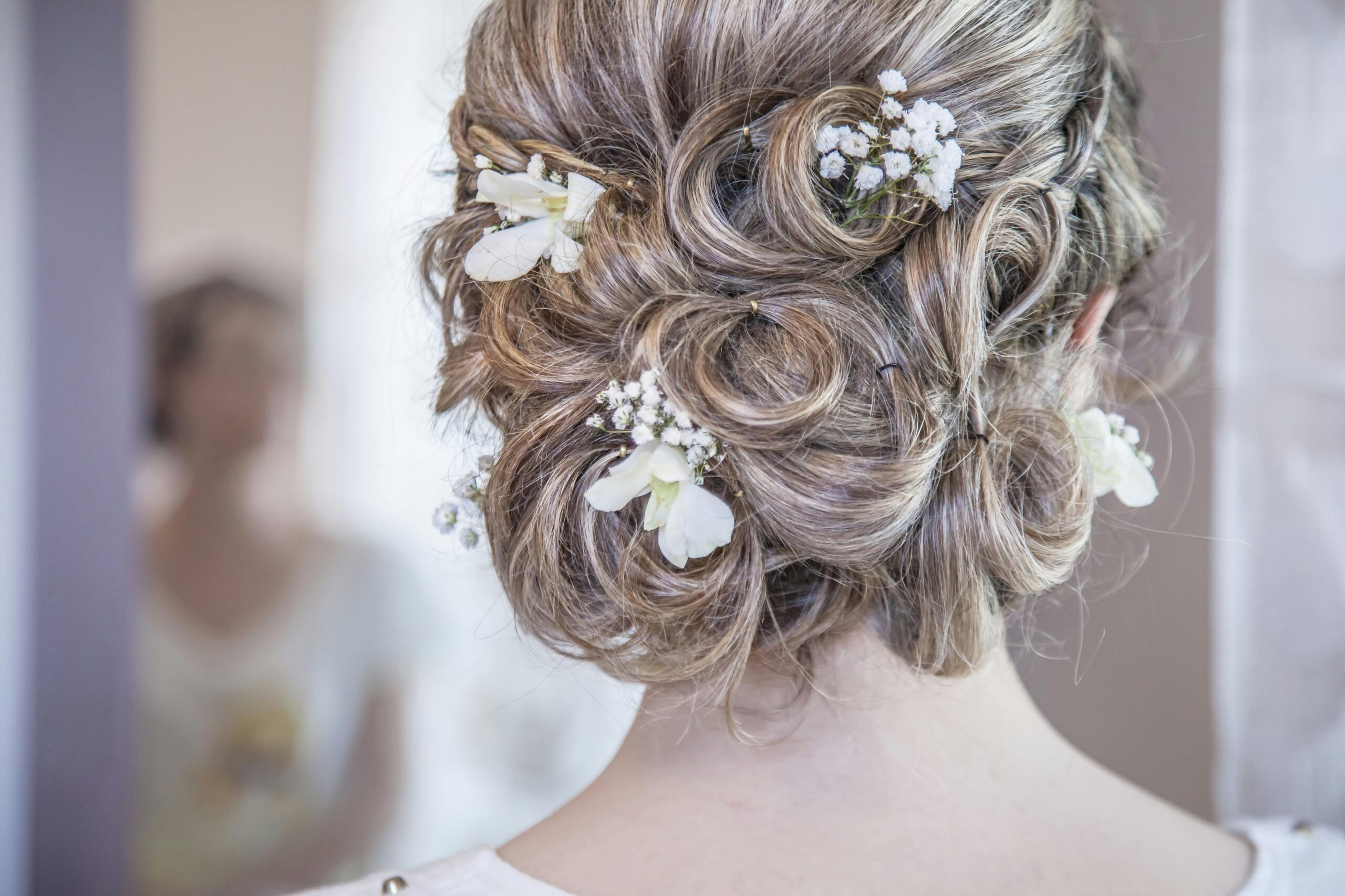 An infographic showing examples of timeless updos including French Twist, Low Bun, and Chignon with step-by-step descriptions.