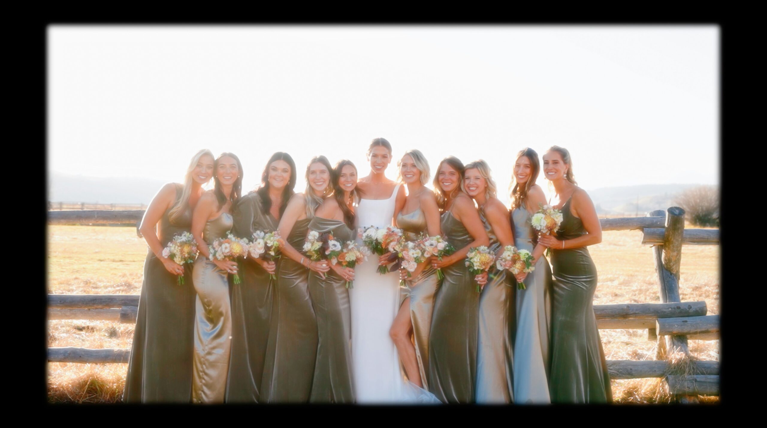 Beautiful bridesmaids showcasing different types of elegant updos at a beach wedding