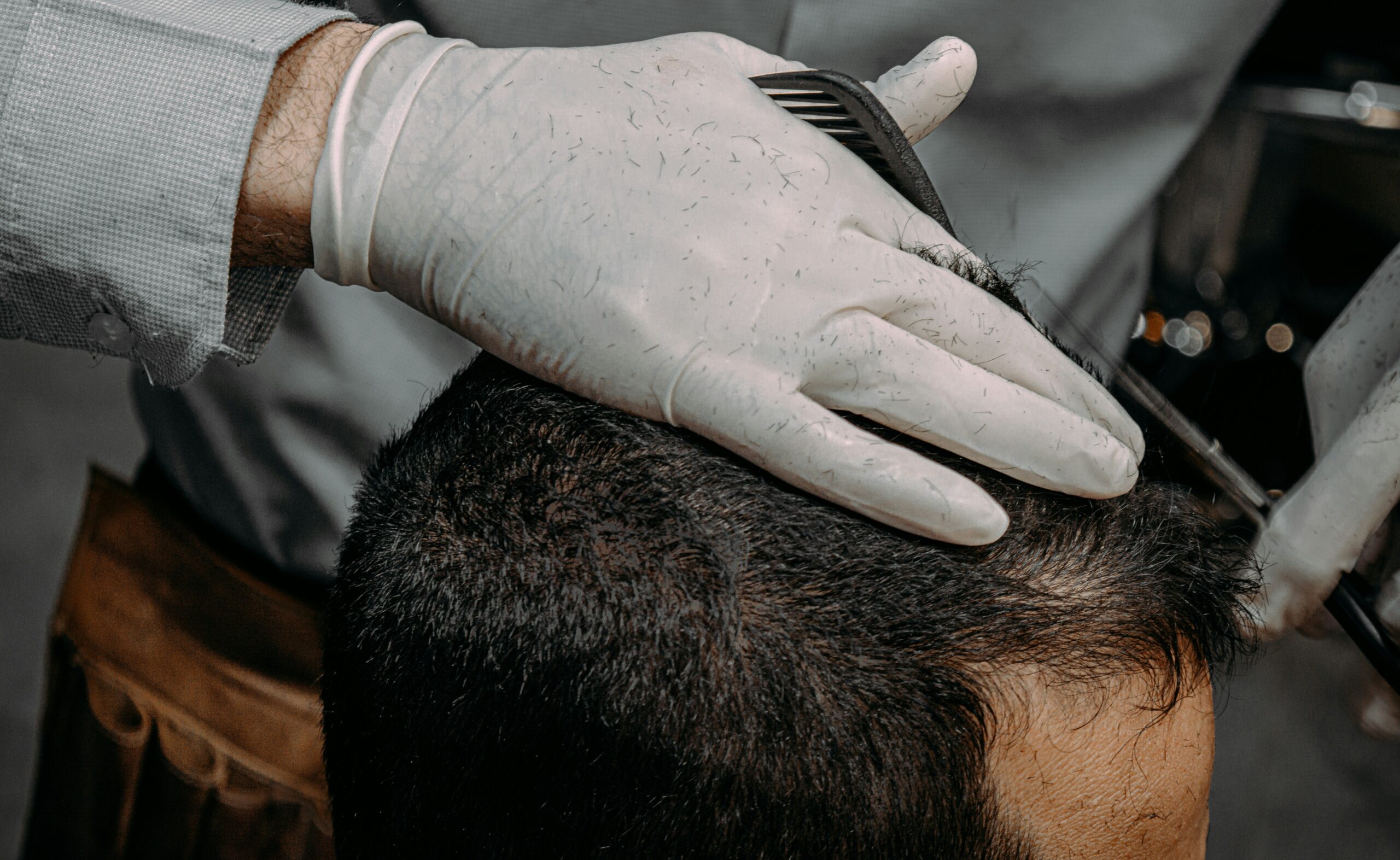 Close-up shot illustrating proper sectioning techniques used by professional hairstylists