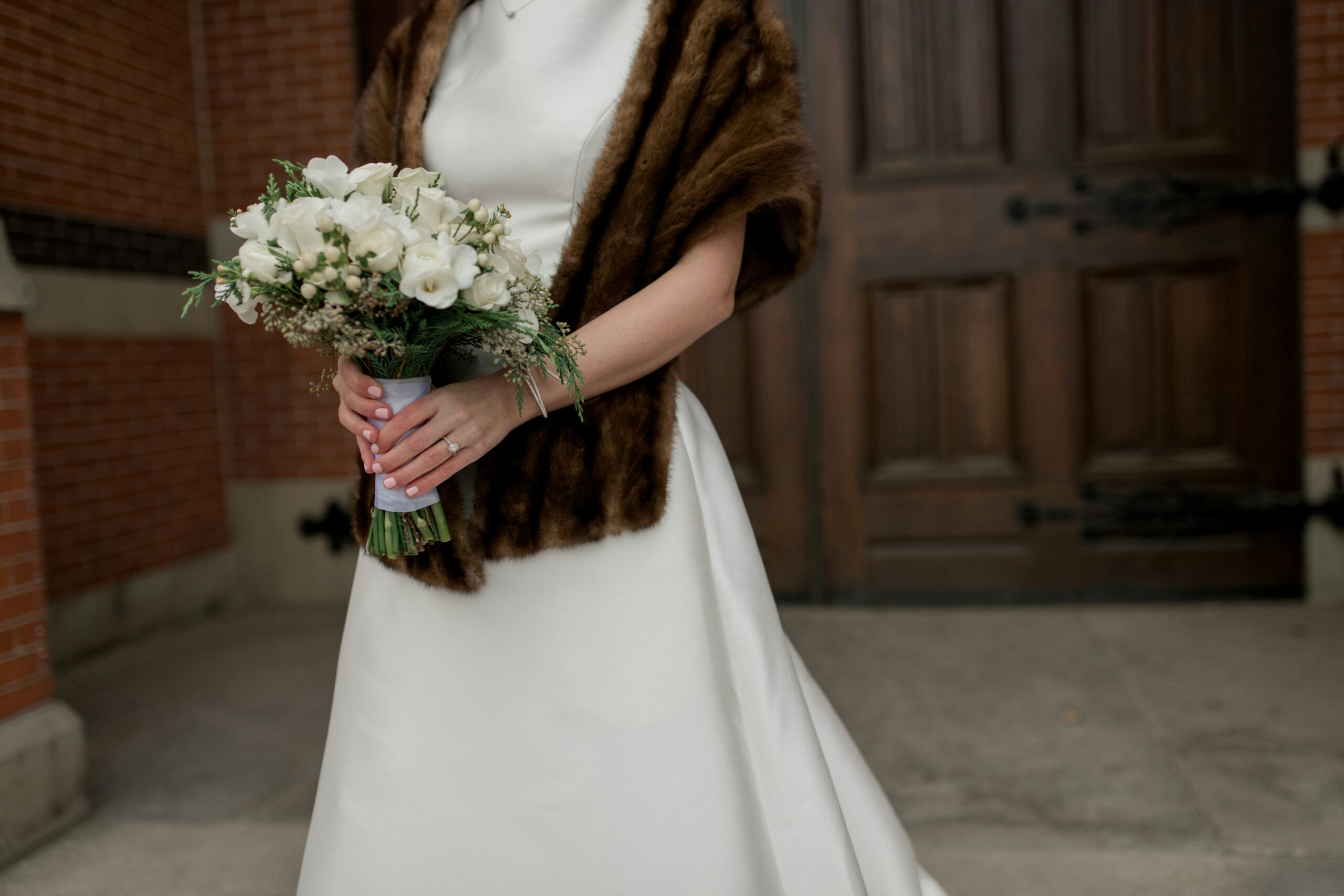 Elegant woman in a formal gown with a sleek updo hairstyle