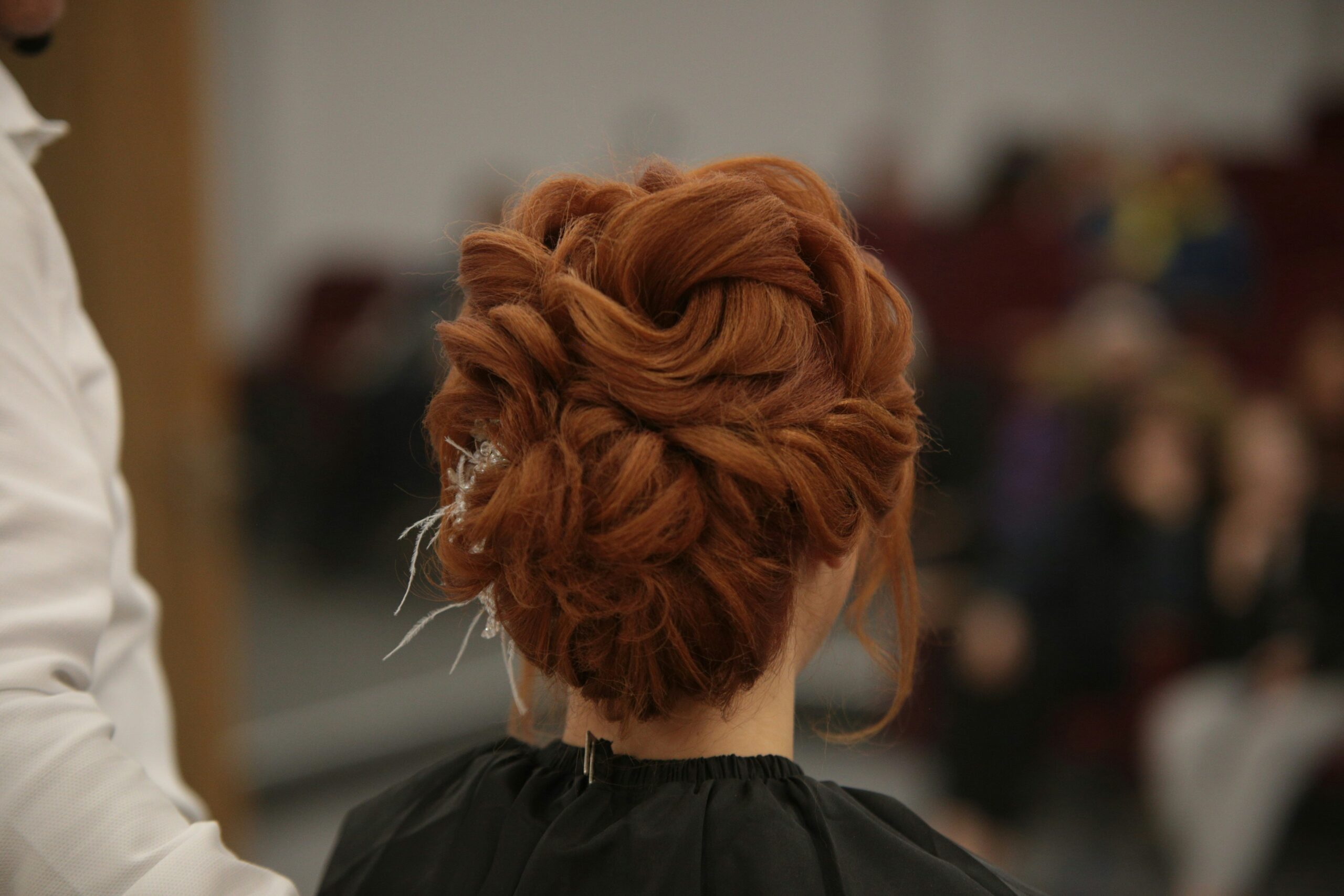 A messy, unpolished updo before lux finishing.