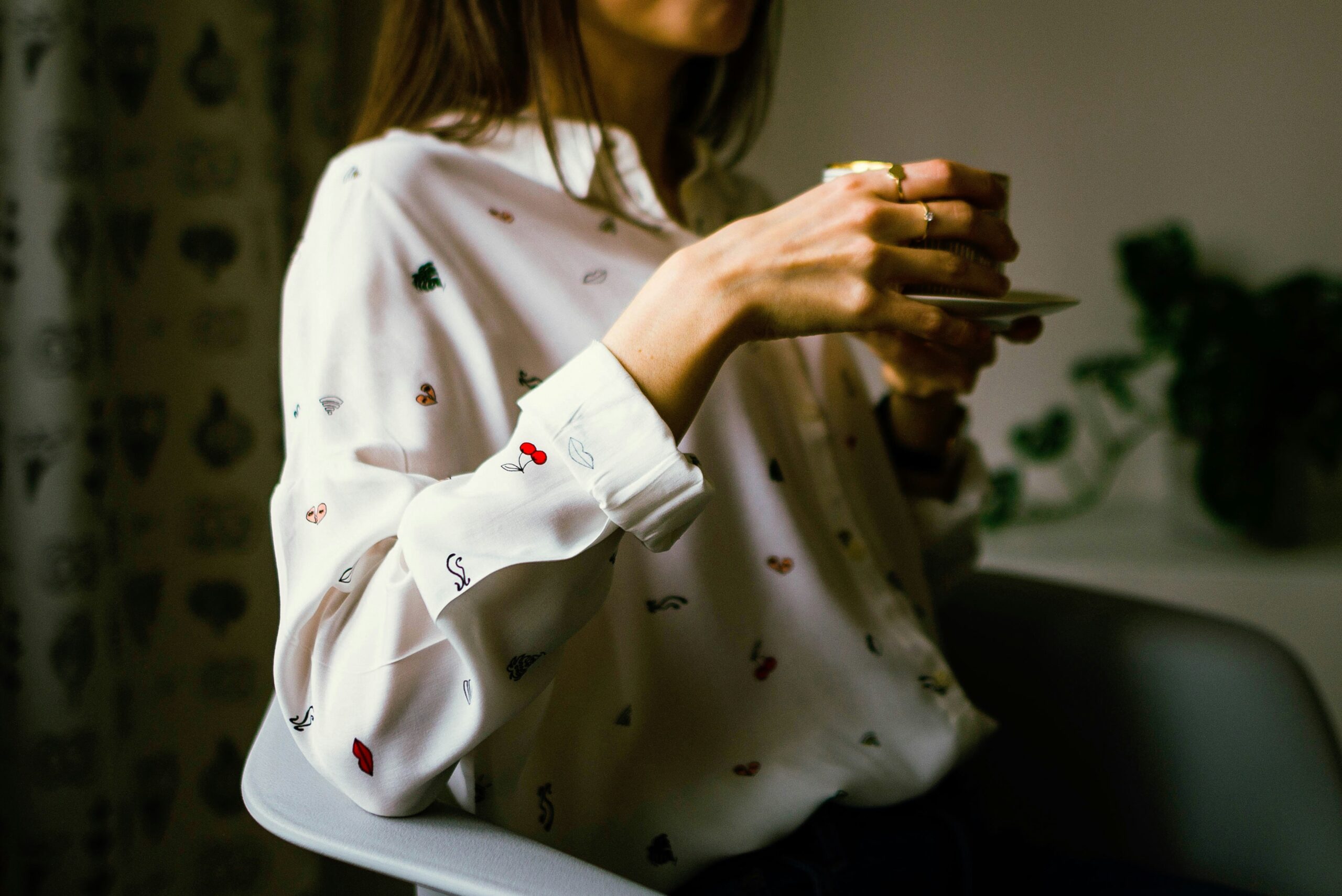 A model wearing a classic high bun secured with bobby pins