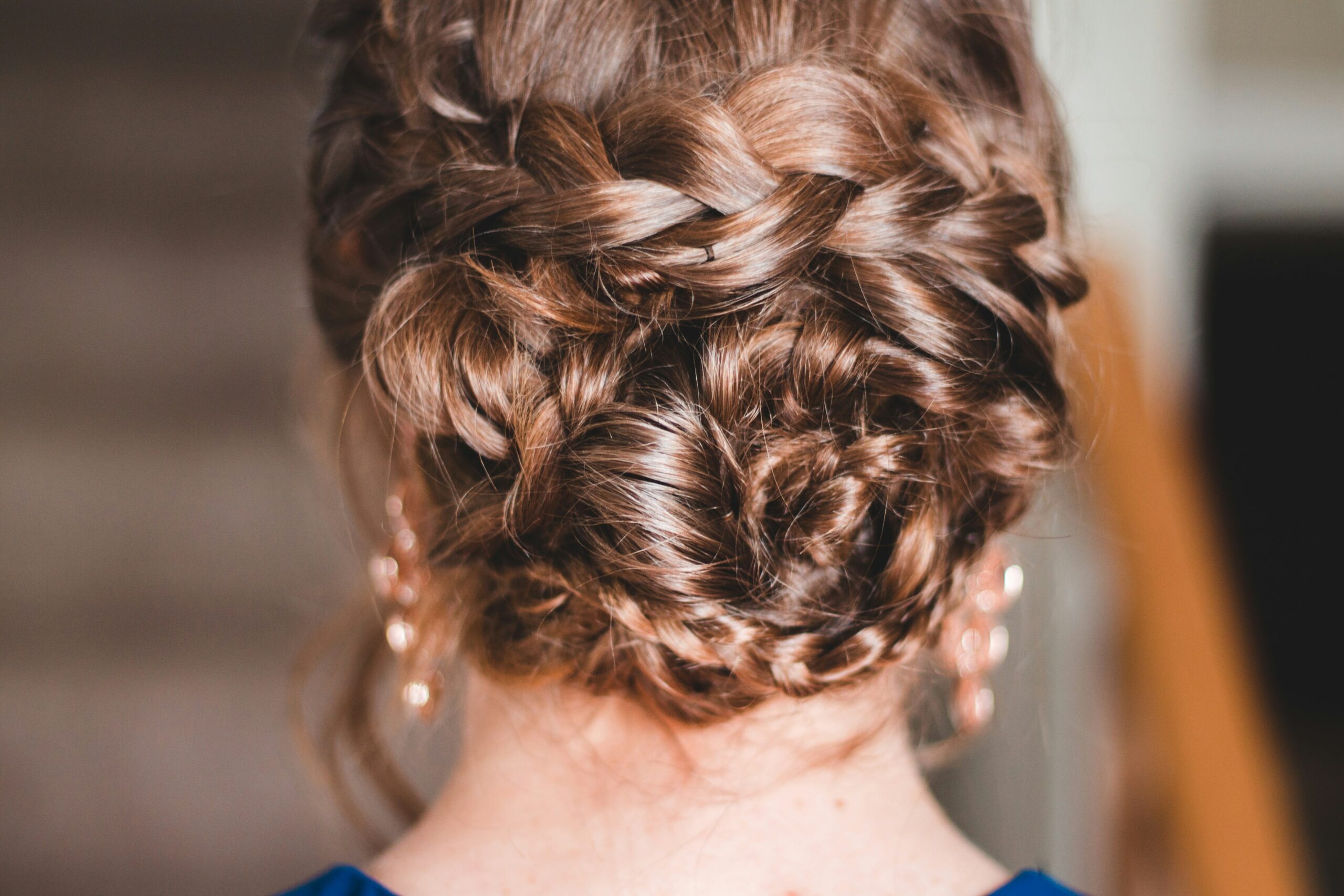 A woman with a boho-inspired messy braided crown hairstyle