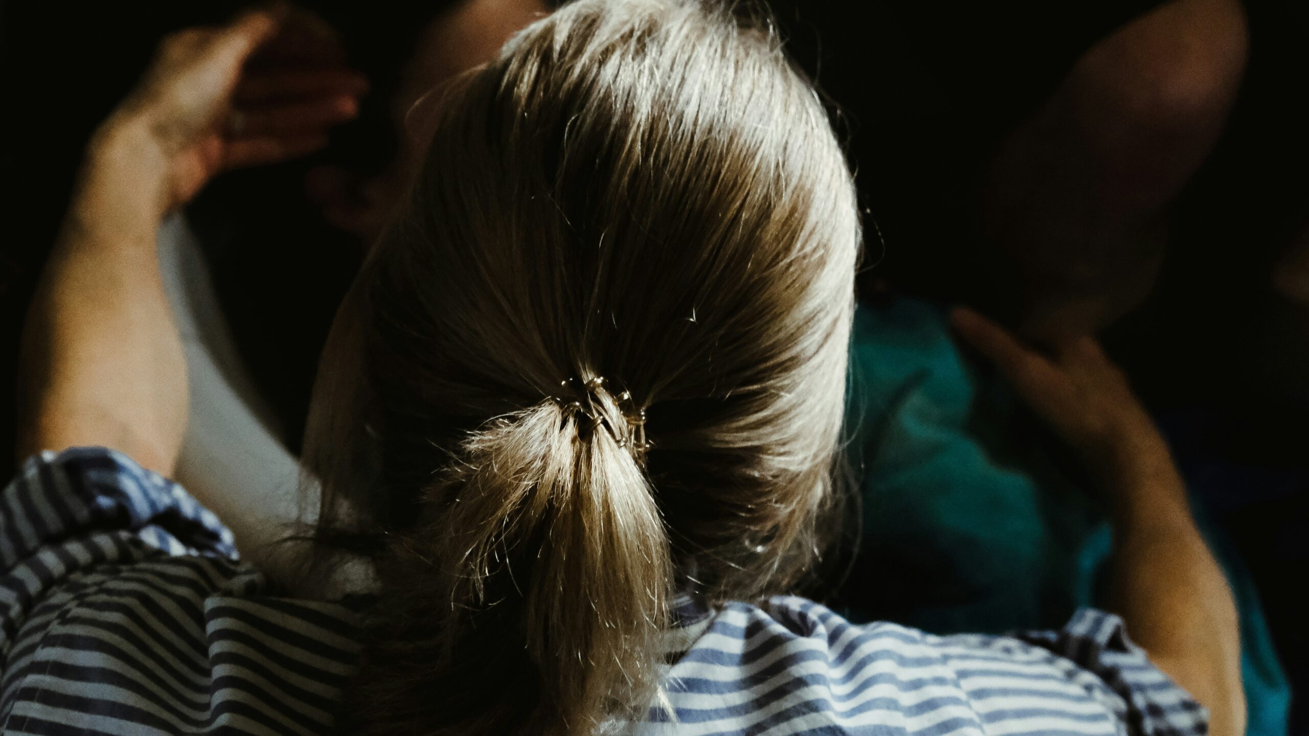 Bride wearing floral-decorated low bun hairstyle