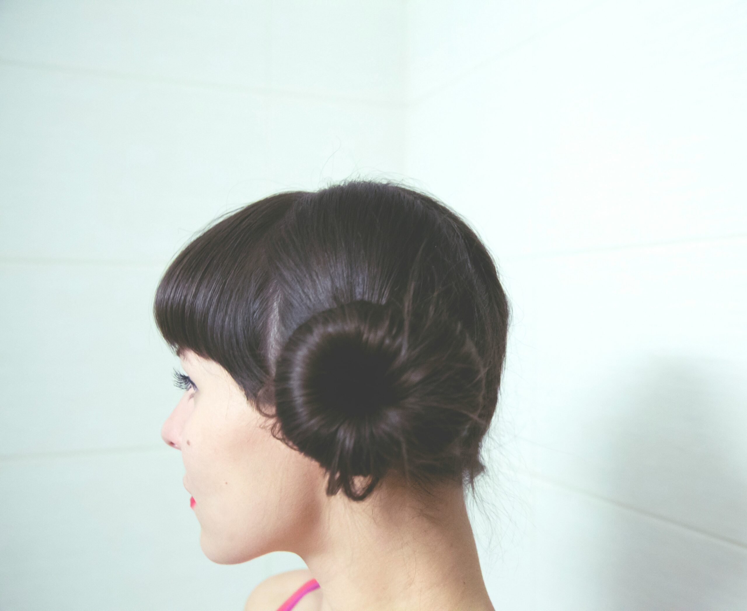 Close-up shot of intricate updo adorned with gold barrettes and crystal combs.