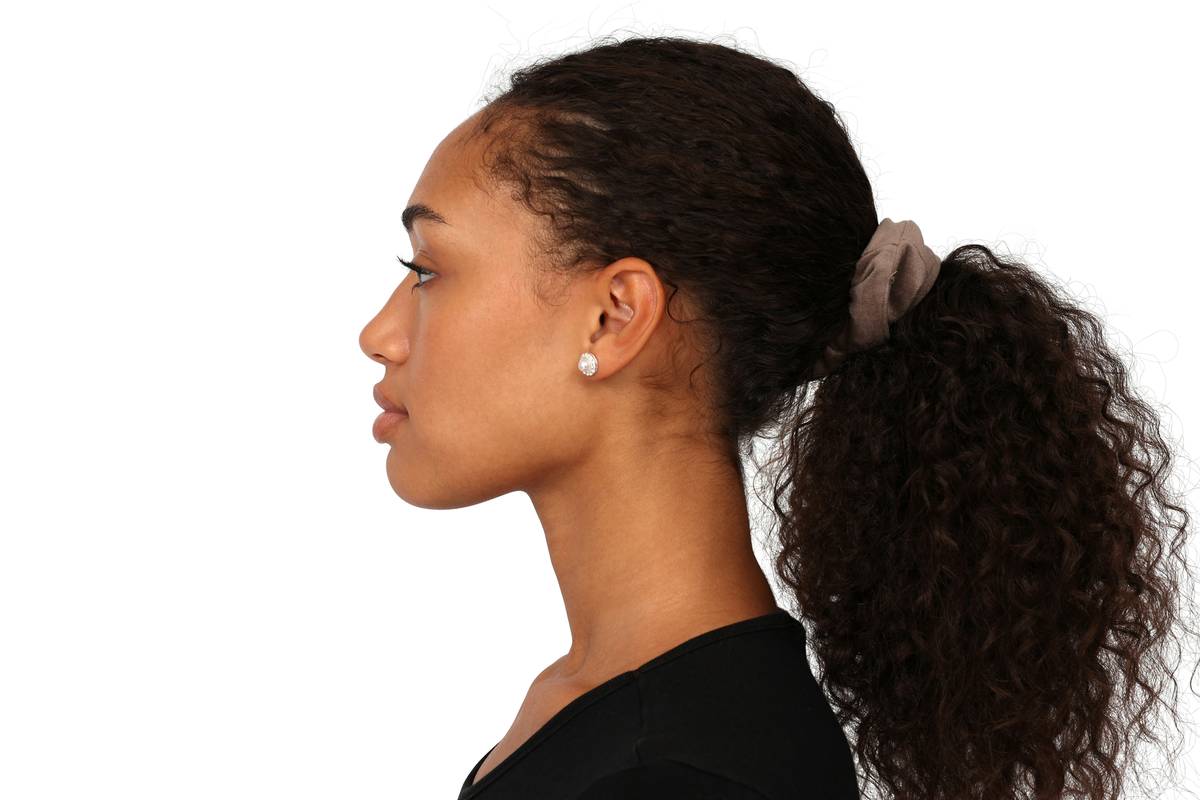 Bride wearing a half-up hairstyle with cascading curls