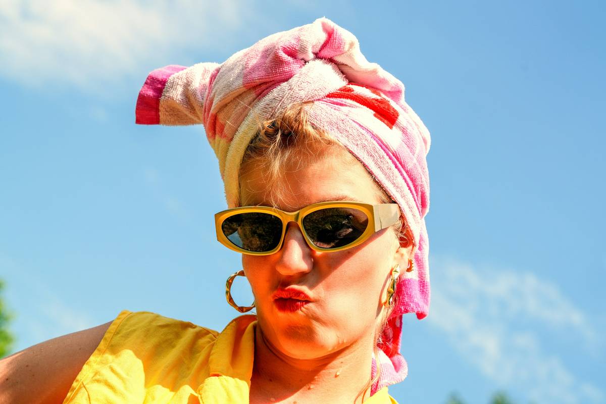 Woman struggling with messy bun hairstyle
