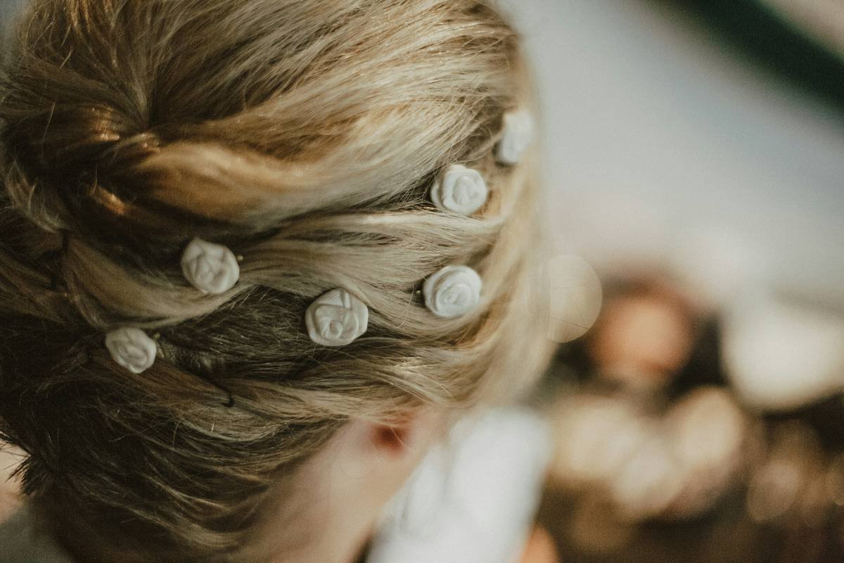 A real bride wearing a sophisticated updo adorned with pearls