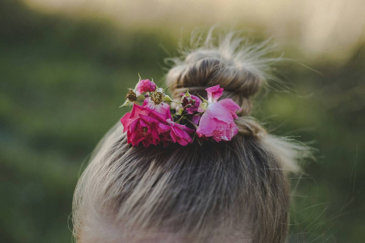 Actress wearing a sparkling updo with accessories on the red carpet.