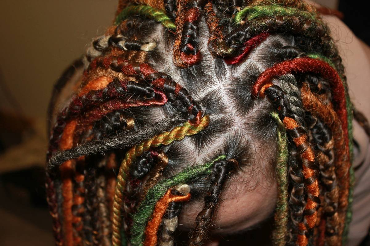 A model showcasing a detailed French twist with delicate braiding.